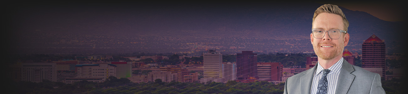 Picture of Matthew J. Bouillon Mascareñas confidently in front of a modern city skyline